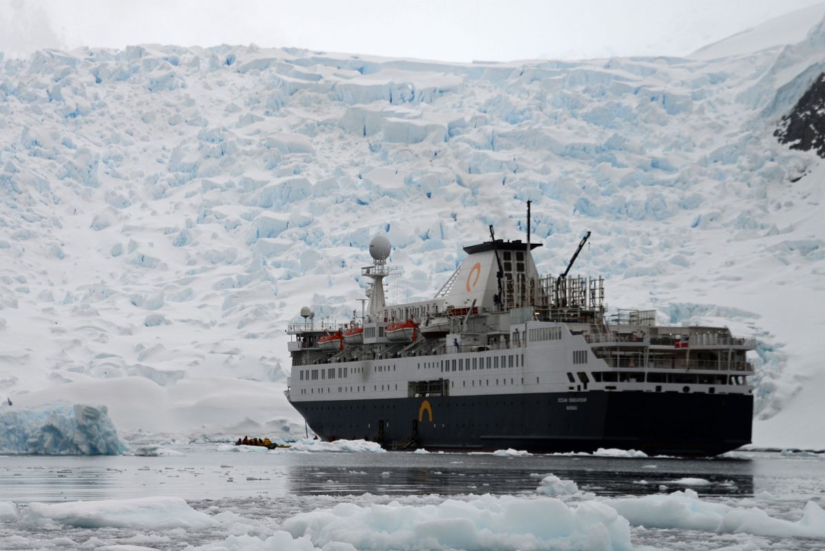 12 Zodiacs Reboarding The Quark Expeditions Antarctica Cruise Ship With Astudillo Glacier Towering Behind